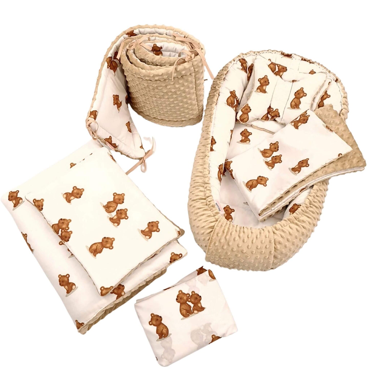 A 9-piece baby bedding set featuring a baby nest, cot bumper, quilt, pillow & fitted sheet, made from 100% breathable cotton with plush beige minky fabric on the reverse, perfect for a cozy, safe nursery.