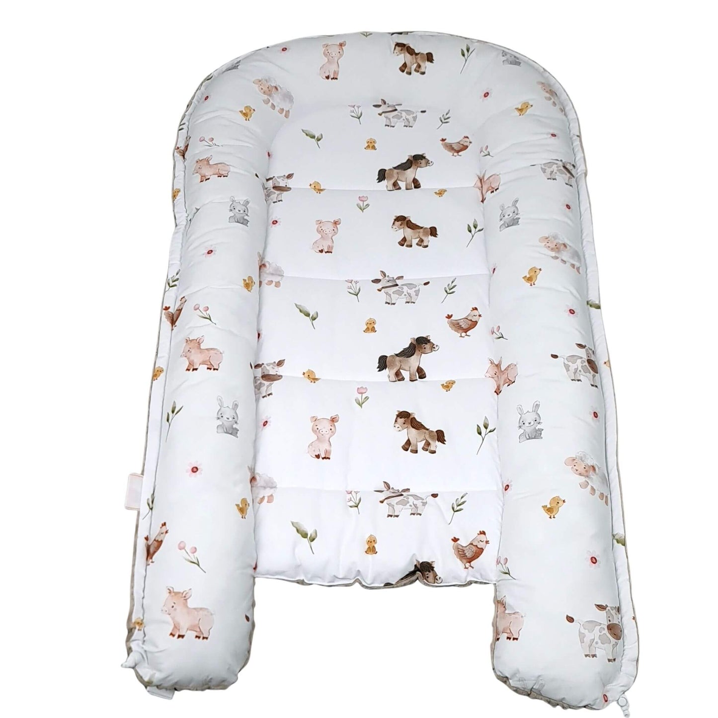 Baby lounger with animal pattern on a white background play mat and changing mat