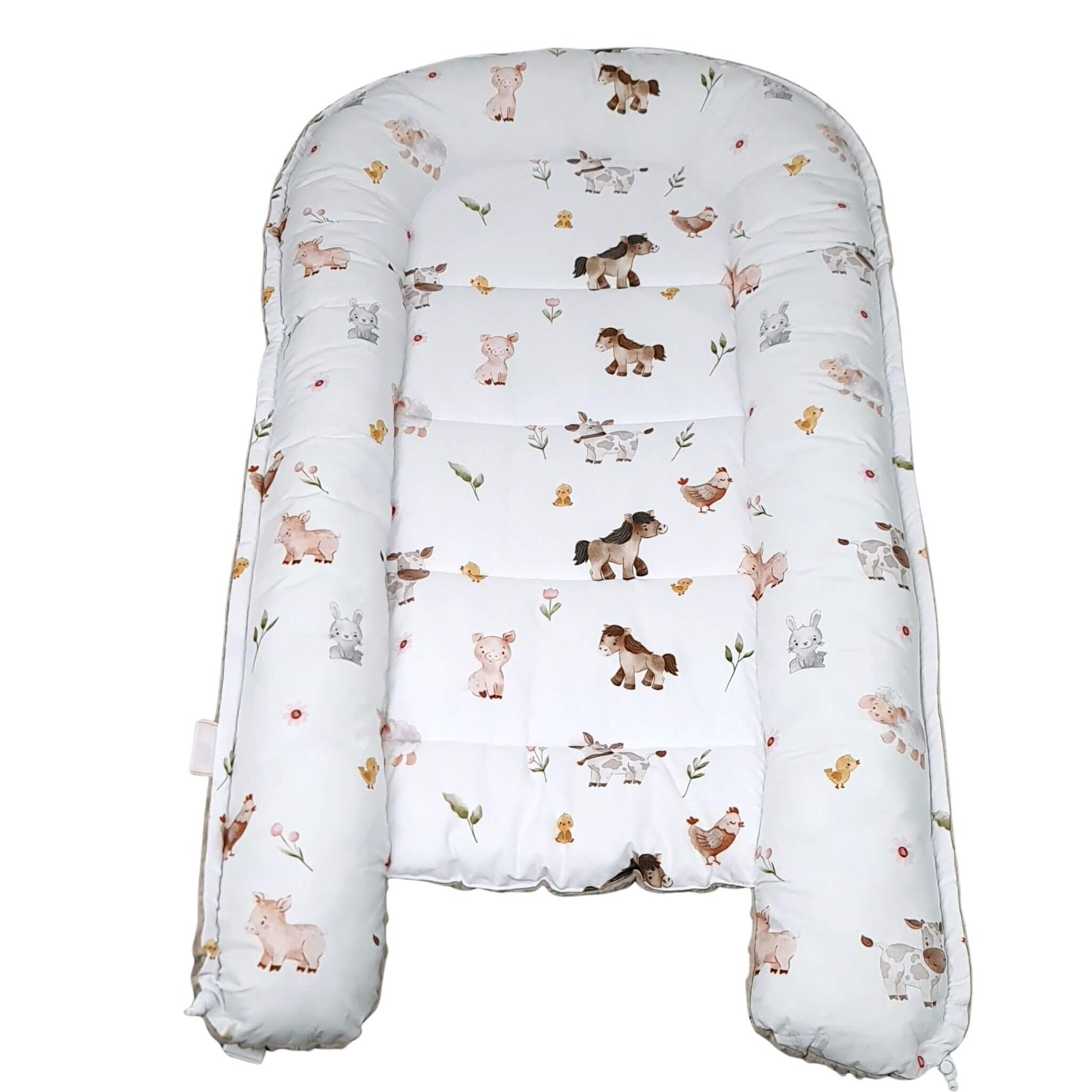 Baby lounger with animal pattern on a white background play mat and changing mat