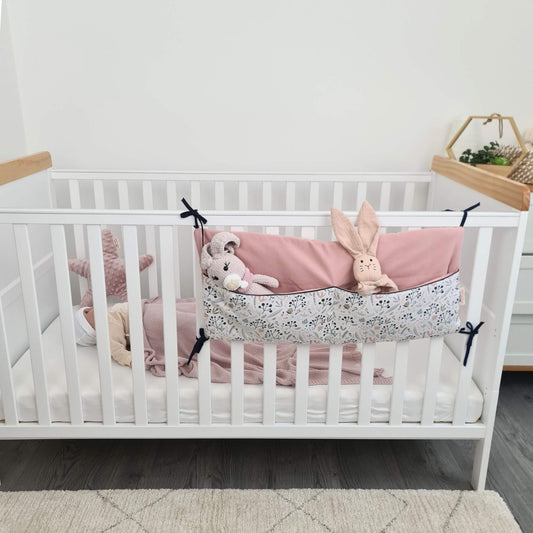 baby crib organizer hanging pouches for storage in the nursery pink colour