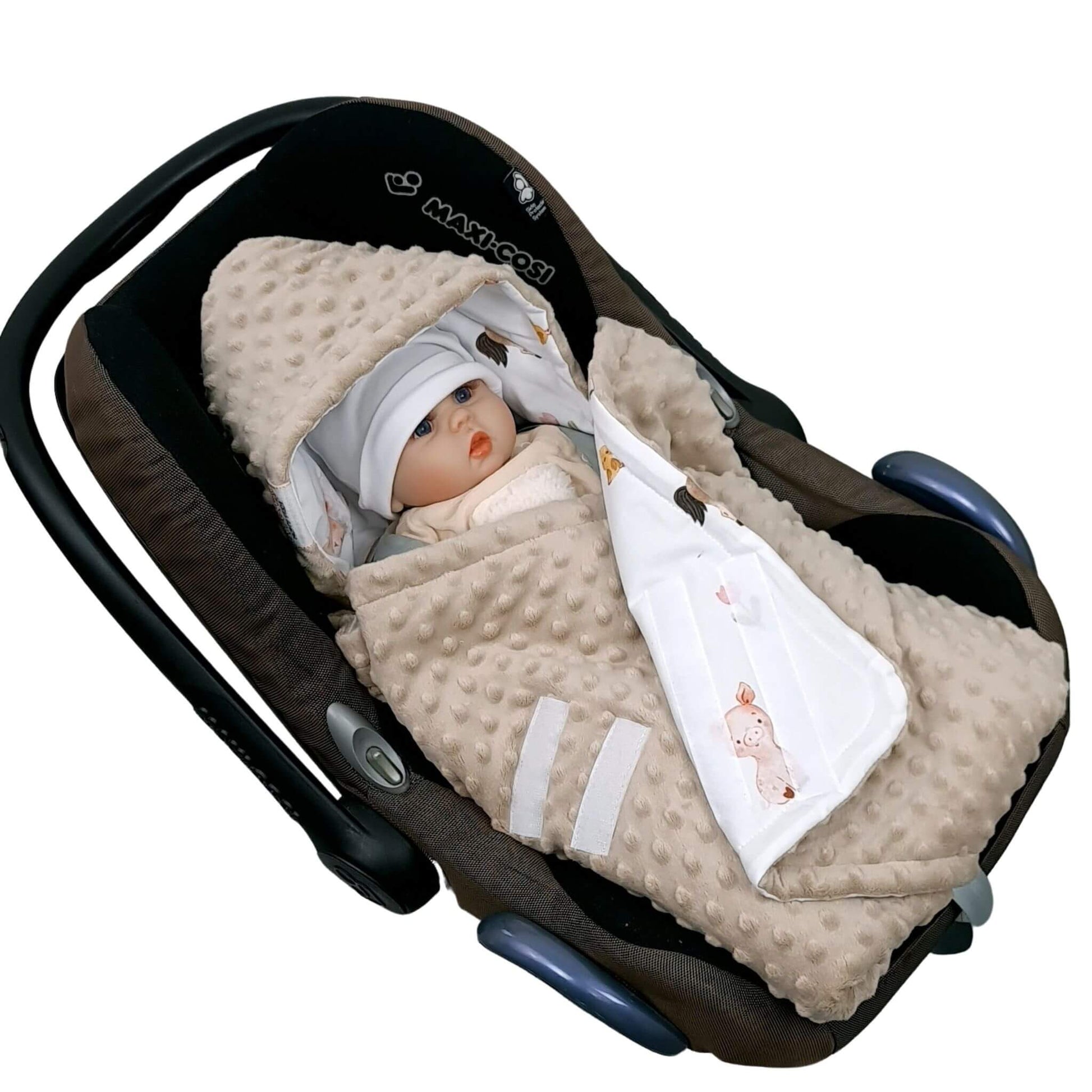 baby in a car seat for infants covered in soft fleecy swaddle with hood and velcro cosure