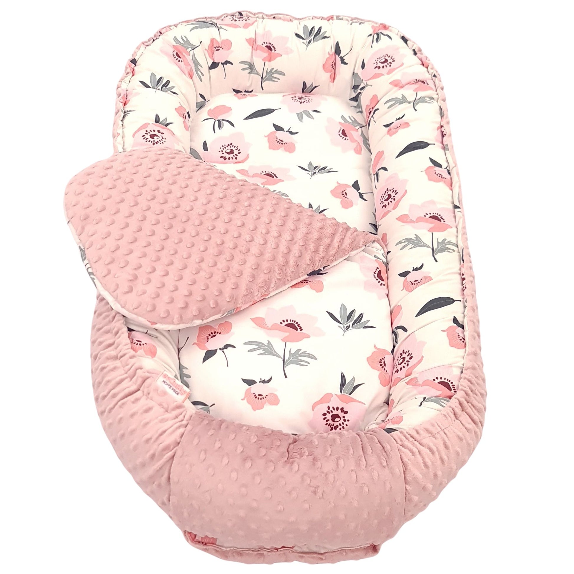 Close-up of poppy flowers cotton fabric and soft blush pink dimple plush nest  junior size up to 36 months sleeping pod with liner