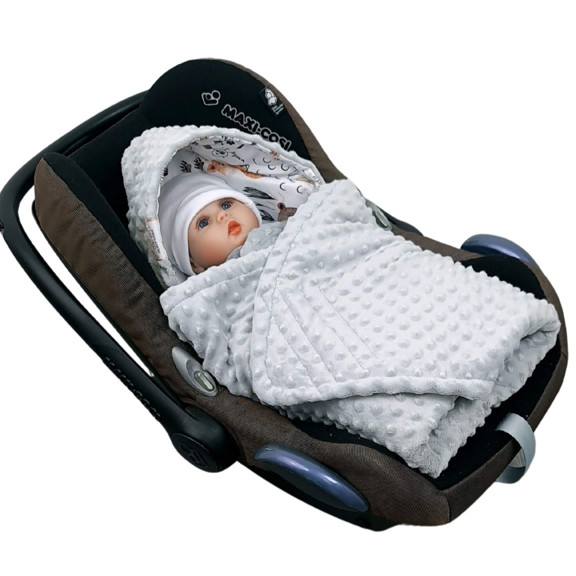 Newborn baby wrapped in Evcushy Forest Animal Friends car seat blanket with woodland animals design