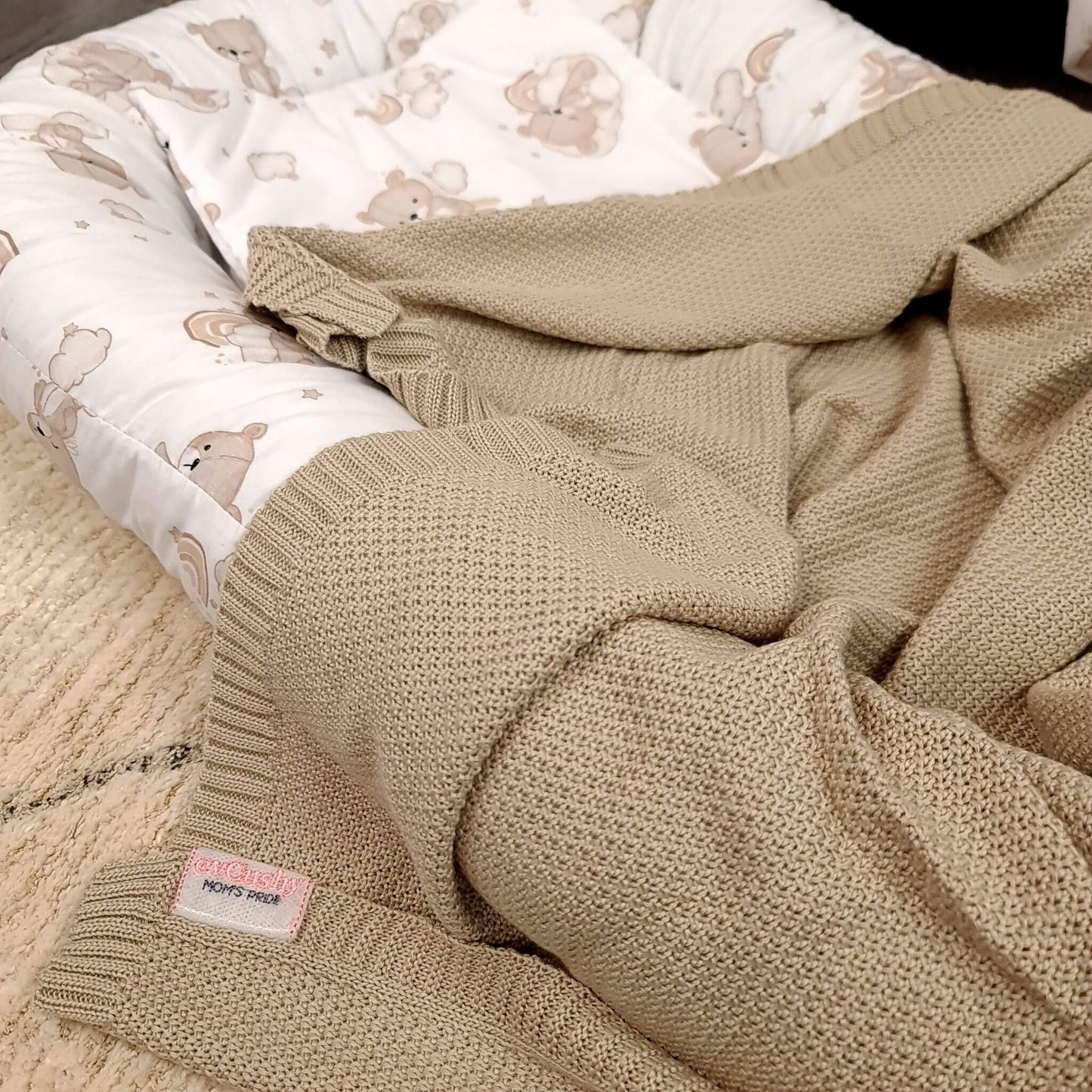 haandmade baby nest for newborn made of cotton with teddy bear print in natural beige colour and bamboo blanket in matching colour
