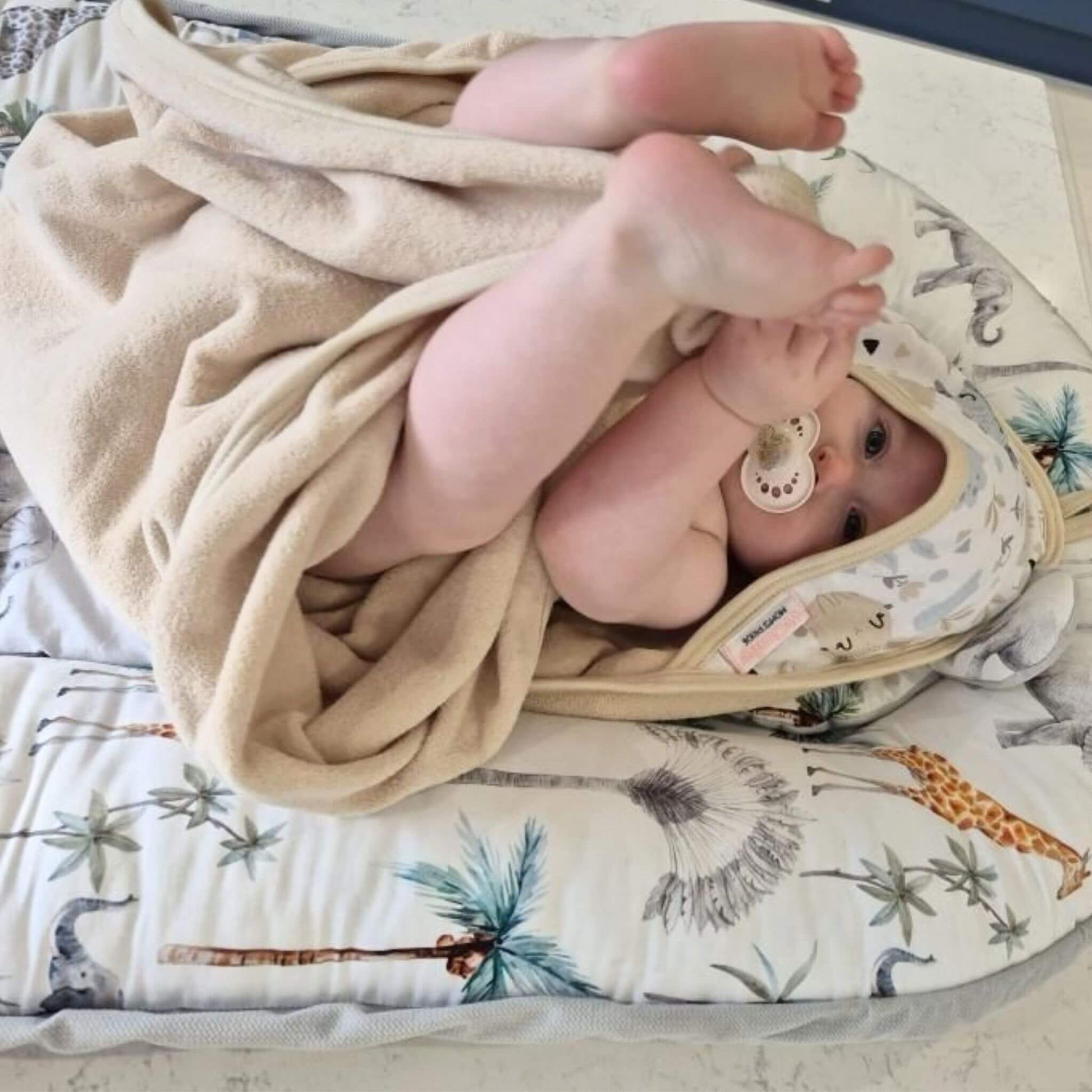 baby in a cosy warm cotton towel  with hood that suits r children from 0-5 years big size towel