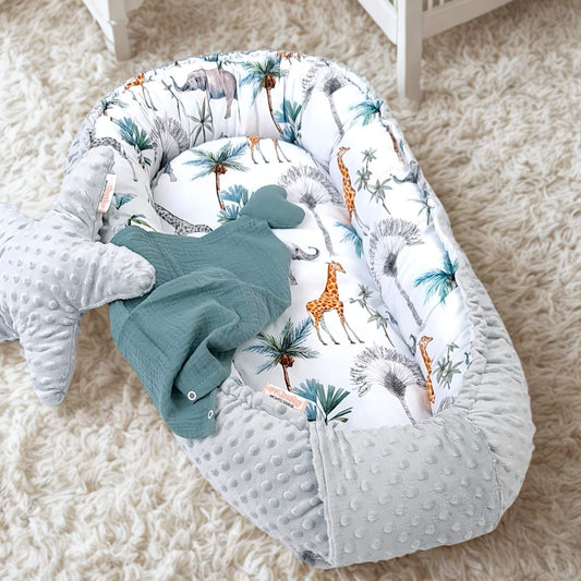baby nest for newborn grey plush minki fabric and 100% cotton safari jungle animals pattern lying on the floor in baby nursery