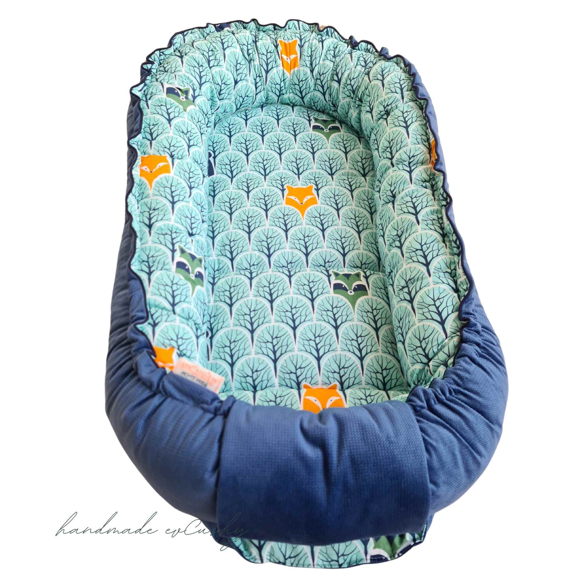 baby nest sleep pod blue and mint colour with forest animals pattern evcushy