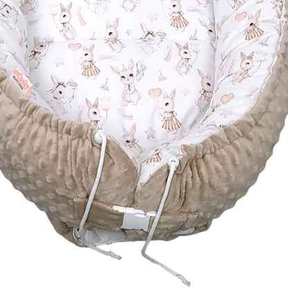 Side view of XXL Blush Bunny baby nest showing adjustable buckle and drawstrings