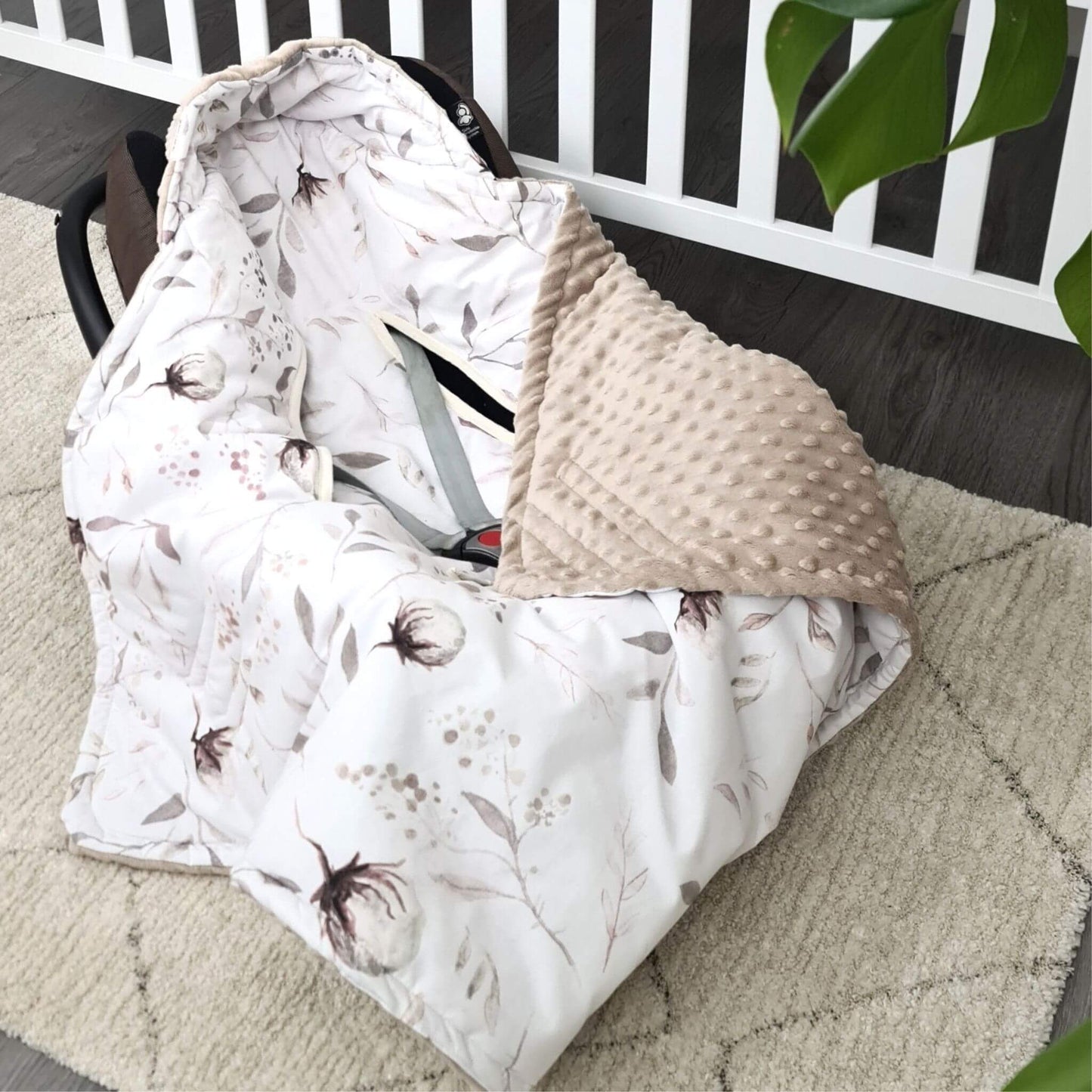 Handmade floral baby car seat cover with plush soft fleece lining, cosy and lightweight for newborns.