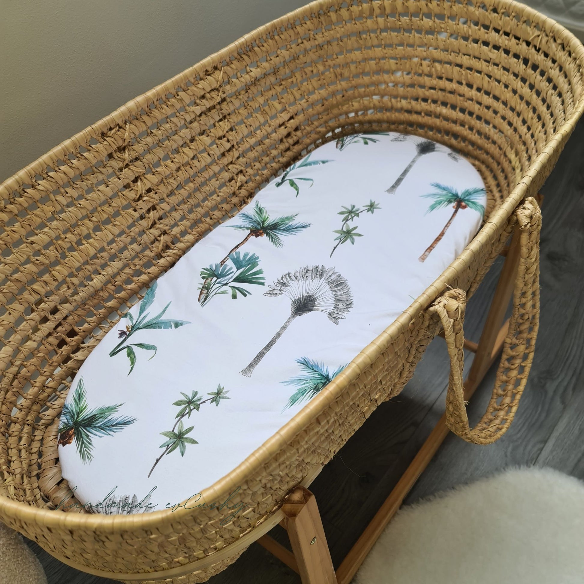 Fitted sheet for Moses basket and carrycot -  white with palm trees grey and green . High-quality 100% cotton for baby's comfort and style.