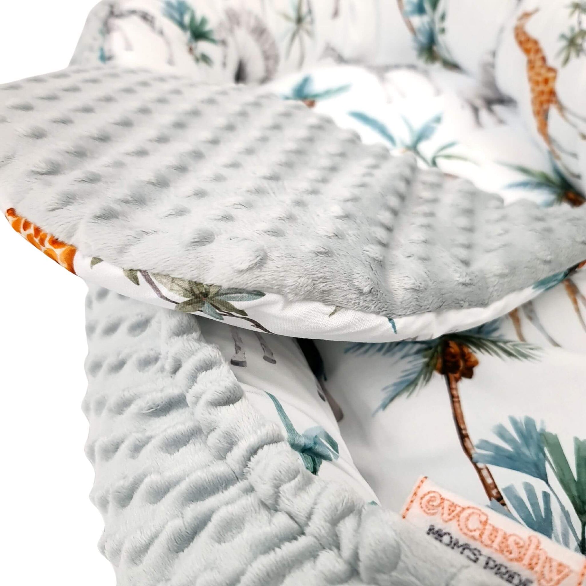 Close-up of safari print in cotton – detailed, breathable, and baby-safe