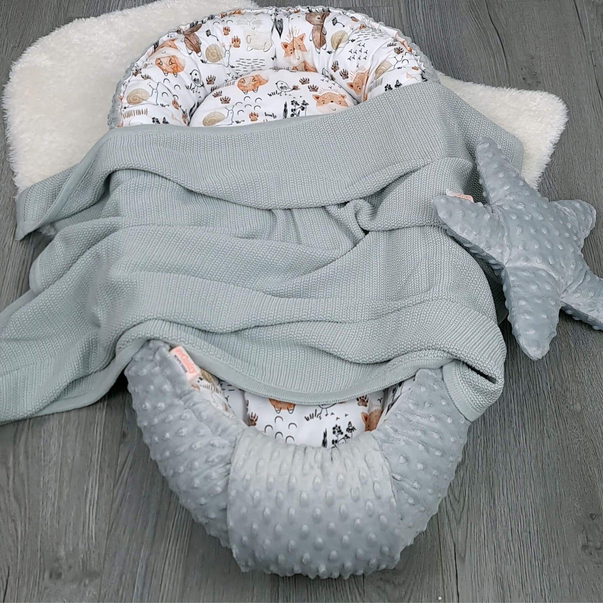 Side angle of Evcushy safe sleep baby pod with grey blanket and soothing star comfort pillow– breathable nest for newborn rest and comfort