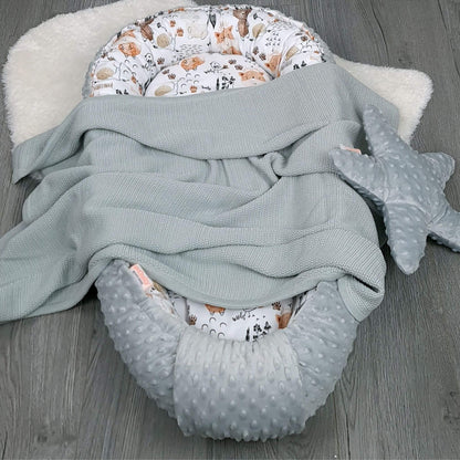 Side angle of Evcushy safe sleep baby pod with grey blanket and soothing star comfort pillow– breathable nest for newborn rest and comfort