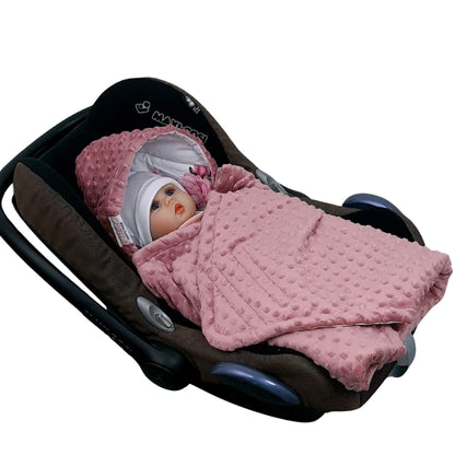 Baby wrapped in Evcushy Blooming Rose Blanket in car seat – soft Foxglove pink minky