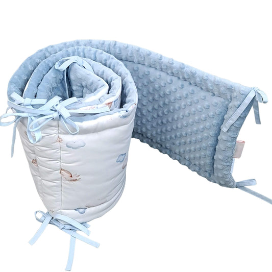 otton cot bumper with clouds, birds, bunting and balloons pattern