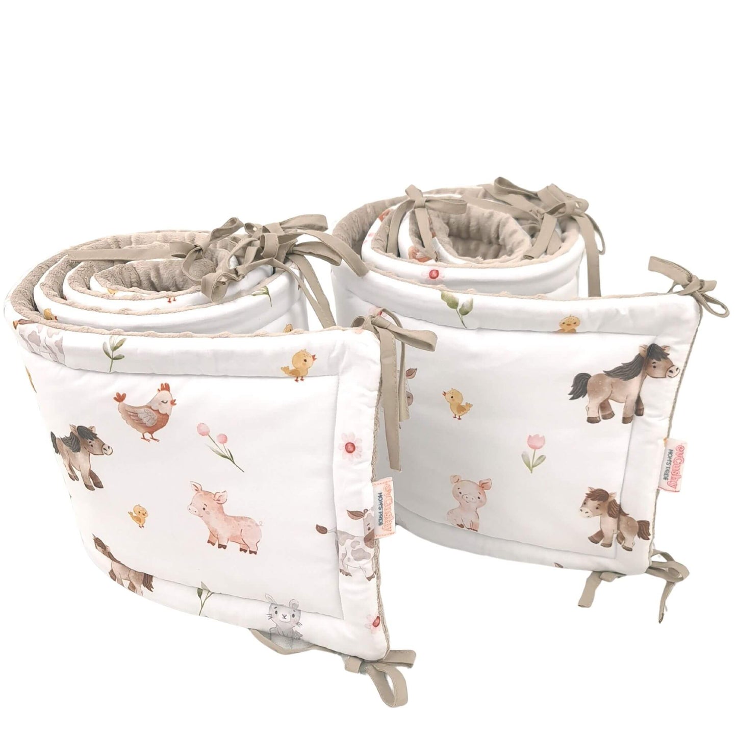 Close-up of Farm Friends baby cot bed bumper fabric and ties set of bumpers o cover the whole cot