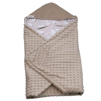 Folded blanket for infants car seat showing geese pattern and mocha plush reverse