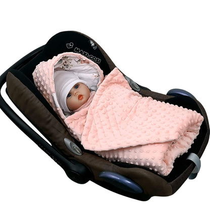 Baby wrapped in Evcushy Hummingbird Garden Blanket in car seat – soft peach pink minky