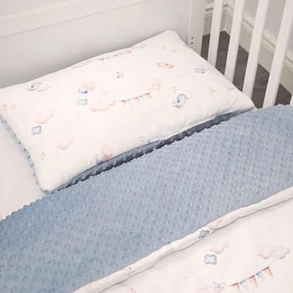 Close-up of Up in the Sky quilt and pillow made from 100% breathable cotton and blue plush