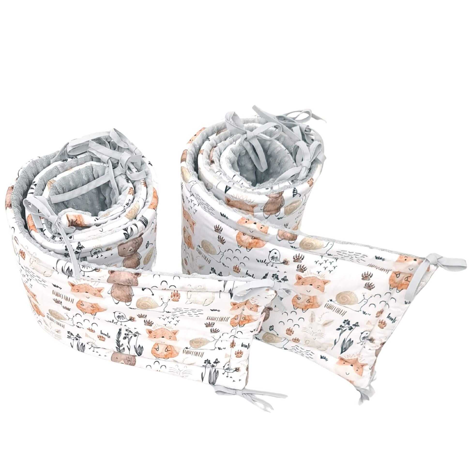 Close-up of woodland animals and forest pattern cotton bumper set for cot bed all around