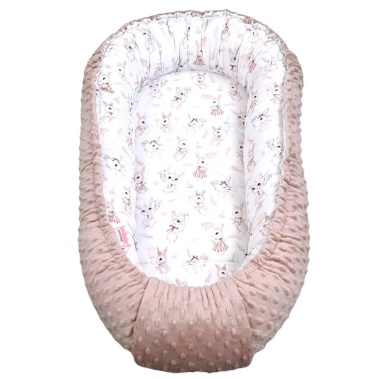 Baby nest with pink minky exterior and white  with pink bunny pattern for newborn to 9 months