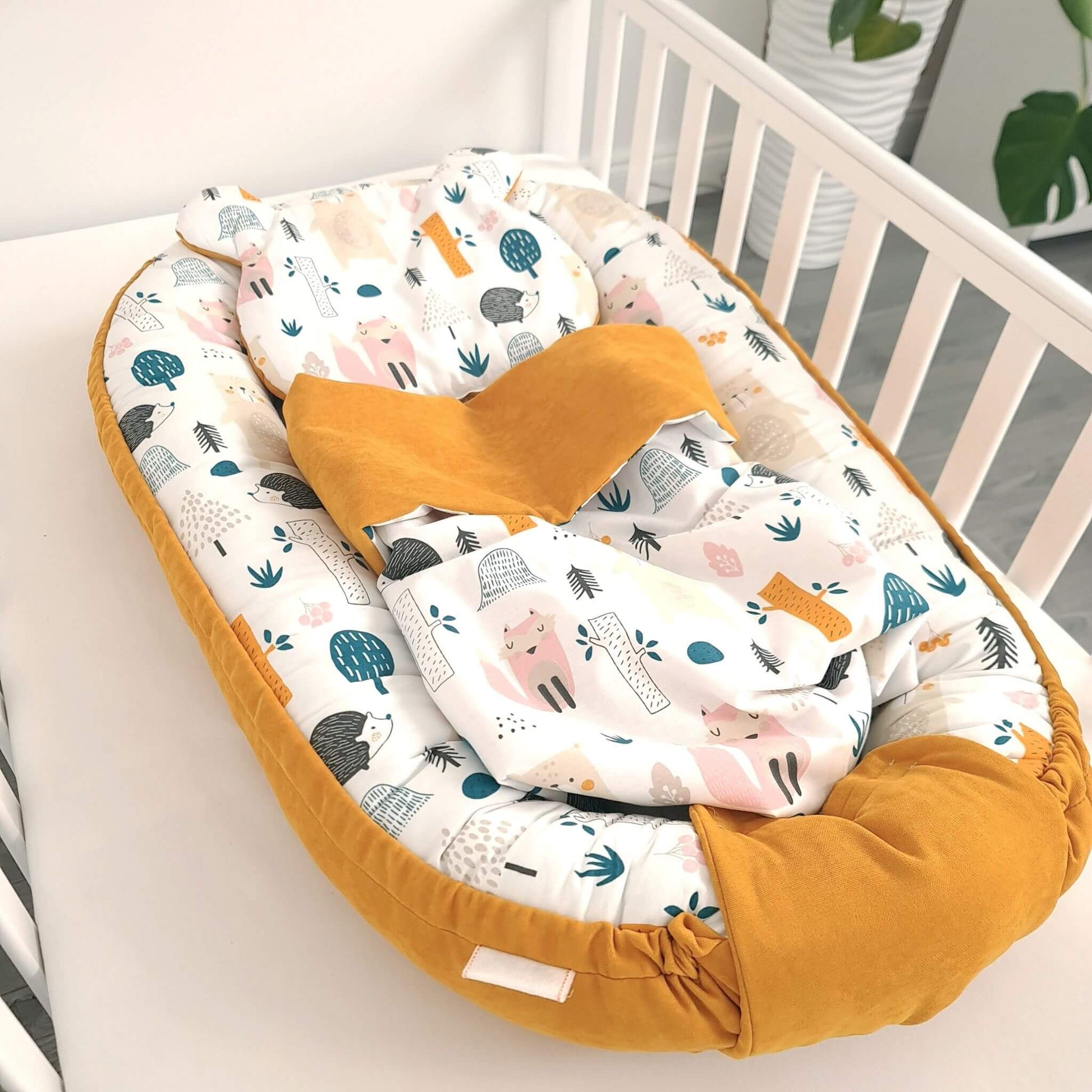 evcushy baby nest with liner pillow and blanket mustard colour and forest pattern