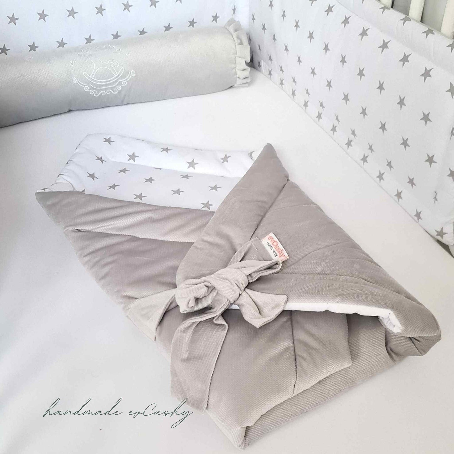 evcushy swaddle wrap for baby grey and white play mat