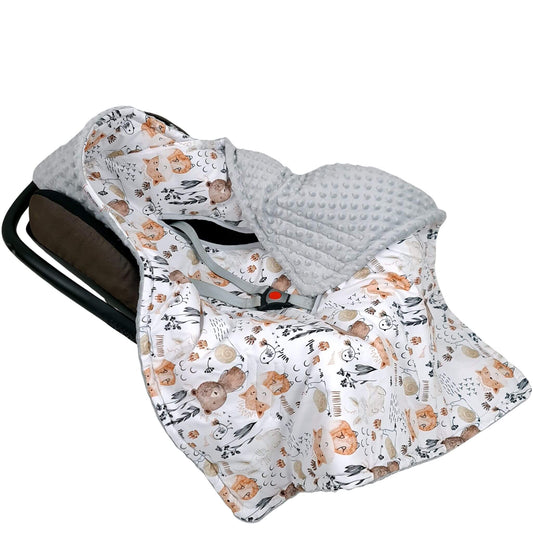 Forest Friends car seat blanket in infant car seat, premium cotton woodland animals print with grey plush, hooded and safe for 5-point harness.