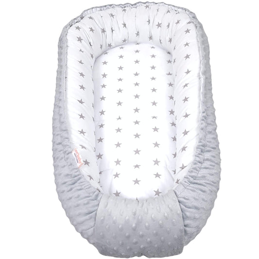 Grey stars baby nest with plush grey minky fabric used as a cosy baby lounger on the floor – handmade newborn nest by Evcushy