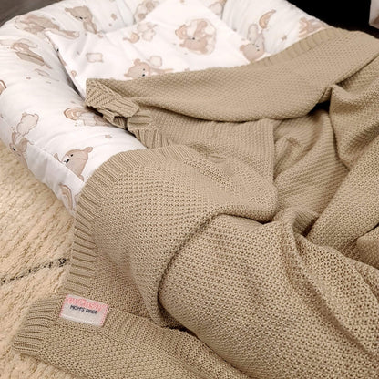 haandmade baby nest for newborn made of cotton with teddy bear print in natural beige colour and bamboo blanket in matching colour
