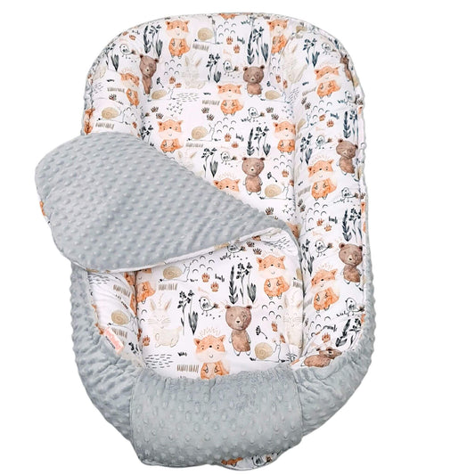 Baby bouncer  nest with teddy bear woodland animals and floral pattern on a white background
