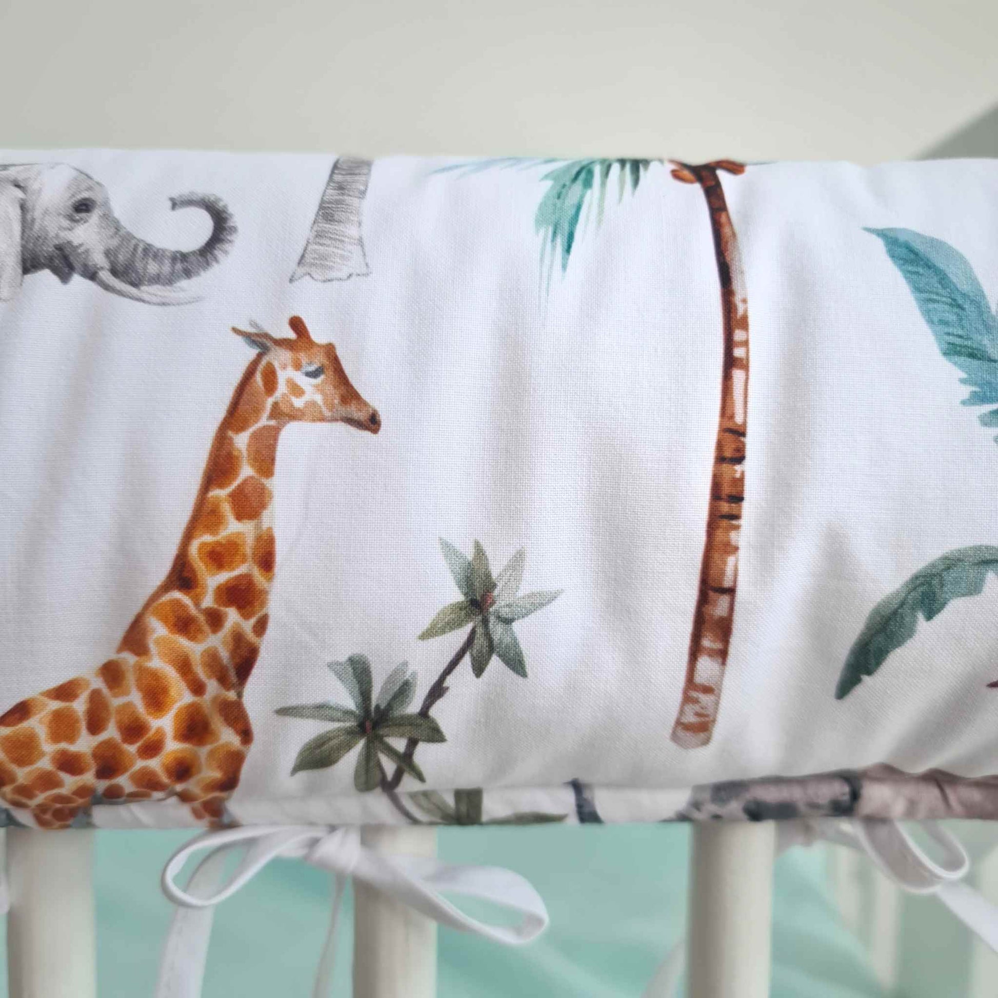safari dream nursery with giraffes and elephants cot bed rail bumper white and grey