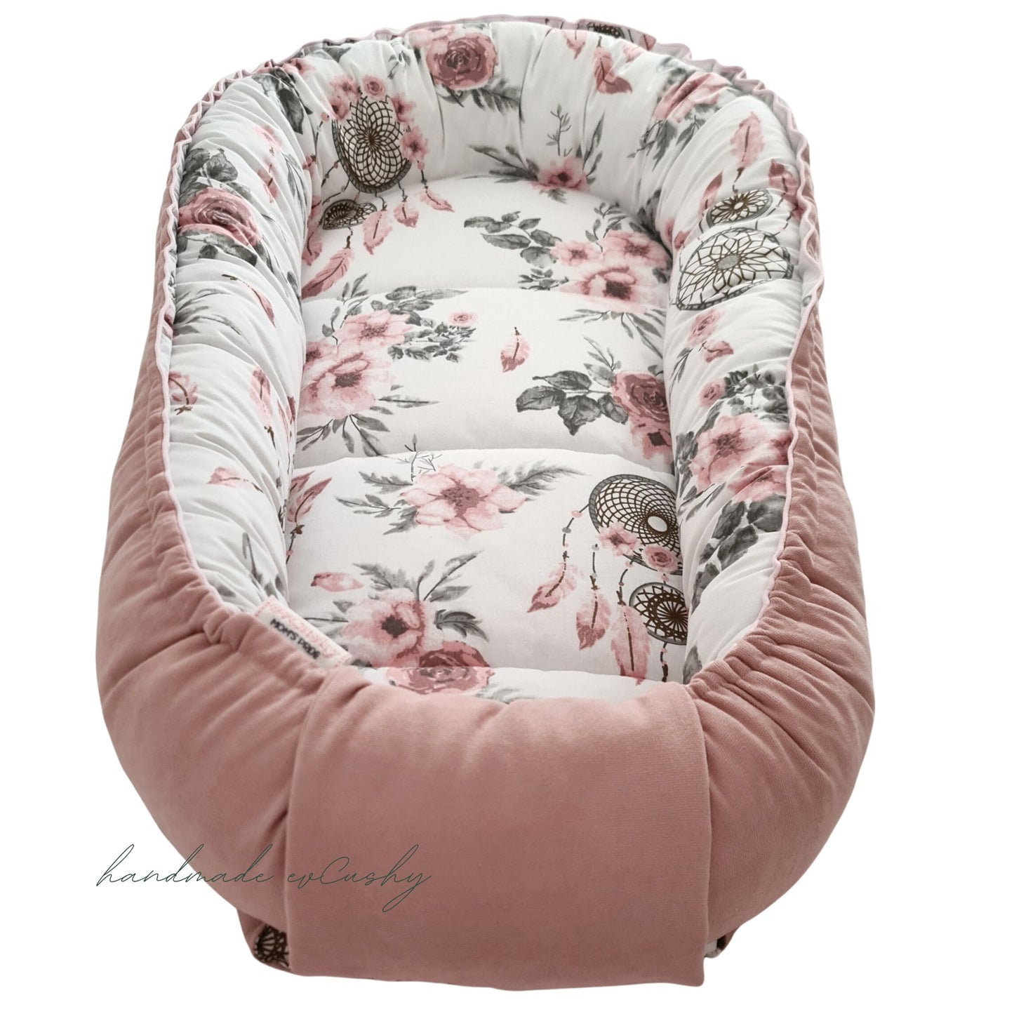 newborn baby essentials sleeping pod cosy and comfortable place to rest lounge. pink with floral design