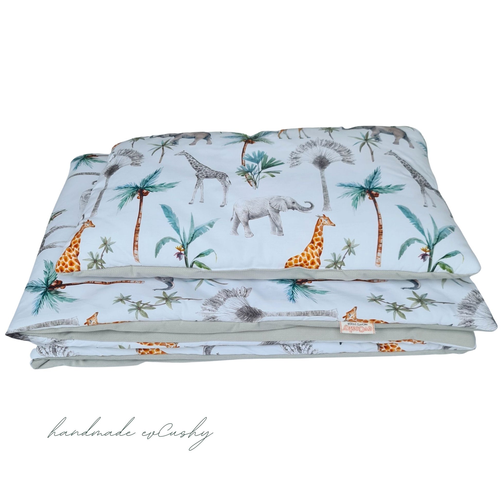 "Image of a charming two-tonal grey and safari-patterned toddler duvet and pillow set, designed to fit perfectly in a cot bed, providing a cozy and adventurous sleep environment."