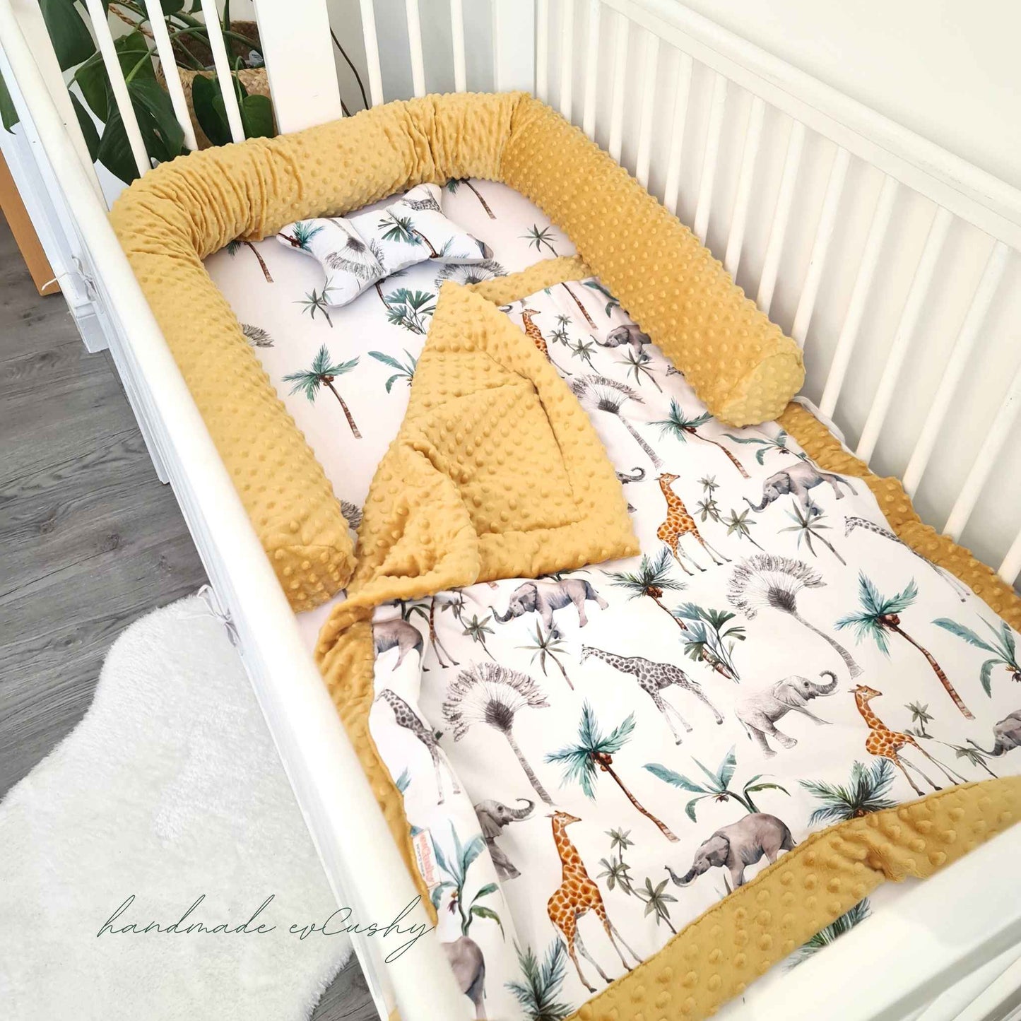 blanket in the cot yellow mustard plush and animals pattern safari matching cot bolster pillow in yellow colour