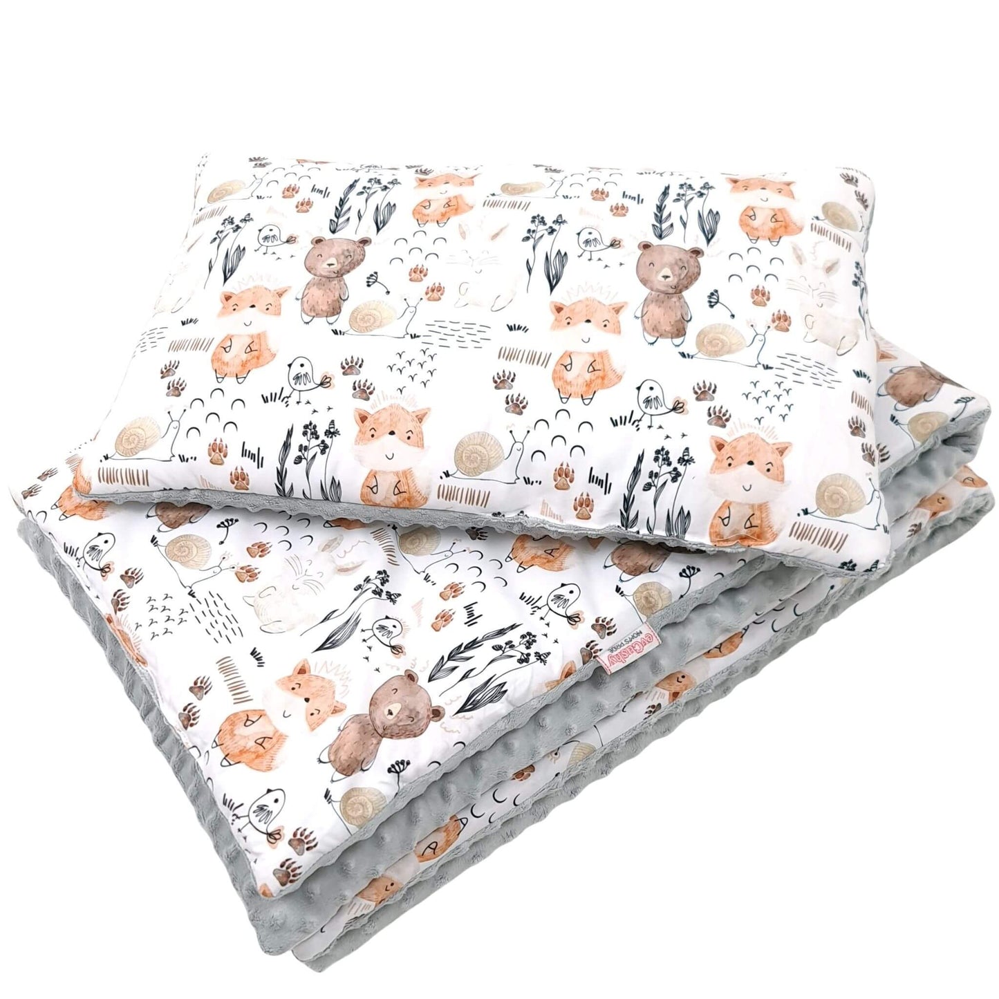 Handmade toddler bedding featuring forest animals and breathable cotton with plush reverse.