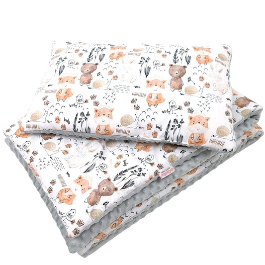 Handmade toddler bedding featuring forest animals and breathable cotton with plush reverse.