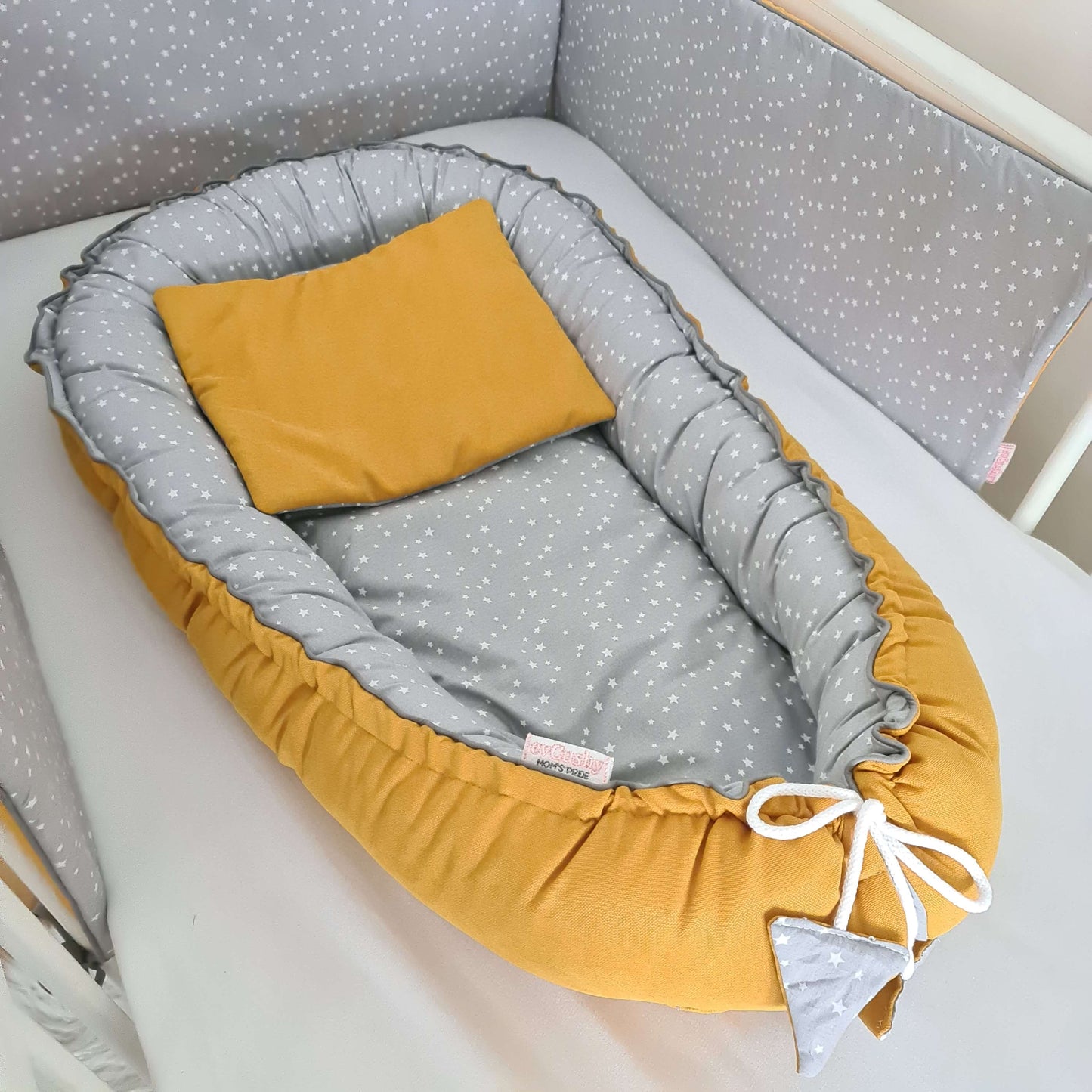 mustard nest for a baby to snuggle and settle to sleep comfy cushion